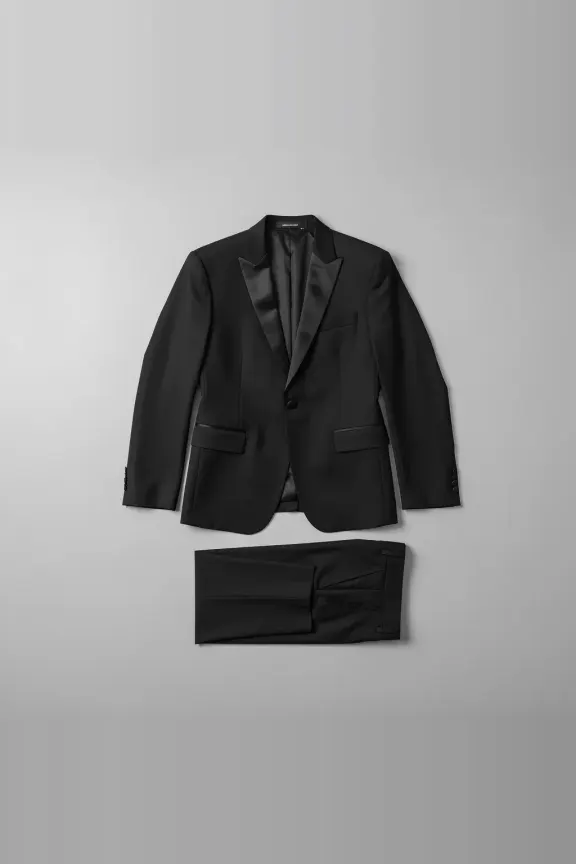 A black tuxedo suit, photographed flat.