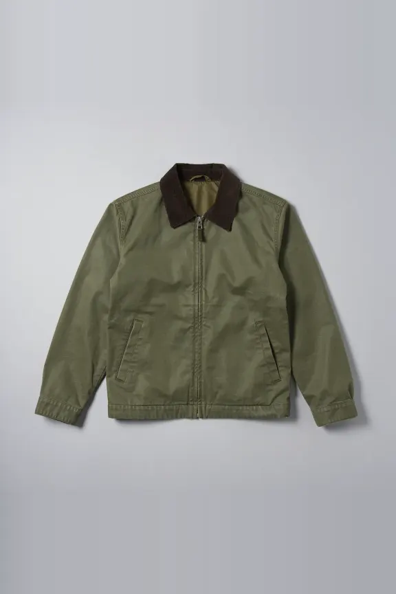 A green waxed cotton jacket, photographed flat.